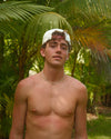Man wearing a cream & red hat backwards